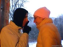 Girlfriend with glasses gives outdoor blowjob on a snowy day
