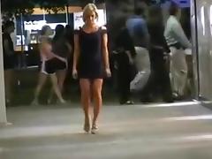 A classy chick flashes her body in public.