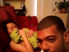 Asian girl makes a sextape with her black bf on the sofa