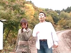 Outdoors with a hairy pussy Japanese girl taking his dick