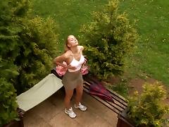 Blonde gets her out out and fucks herself in the garden