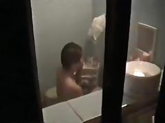 Voyeur captures the neighbor asian girl showering and masturbating