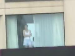 Voyeur tapes the neighbor girl changing clothes in her apartment