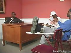 A black teacher and two black students sharing a white guy