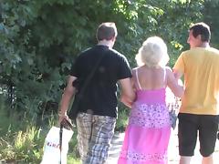Granny and a couple of college guys have a threesome in the woods