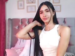 Beautiful long haired brunette Latina amateur teen with spreaded legs in bed