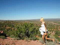 Skinny Emma Mae masturbates in in the middle of a rocky desert