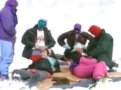Group of people having an outdoor orgy at the ski resort