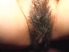 Asian chick shows off her hairy cunt and gives a blowjob