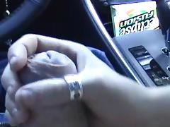 Blonde is wanking a dick in the car