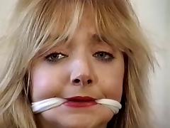 Cute blonde bound, gagged and teased by her master