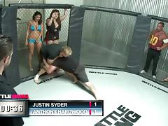 A sporty babe gets fucked hard in the middle of a cage fighting cage